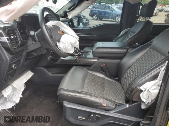 2021 Ford F-150 XL with VIN 1FTFW1E52MFB31825, listed as a Copart auction lot 61462735 with 76,653 mi miles and Salvage title. Bid and sale history available at DreamBid. Image 7.