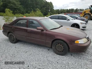 2000 Mazda 626 LX with VIN 1YVGF22D8Y5126950, listed as a Copart auction lot 69440124 with 208,584 mi miles and Salvage Title. Bid and sale history available at carsss.com. Image 4.