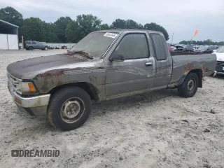 1989 Toyota Pickup DLX z VIN JT4RN93P5K0008068, wystawiony jako Copart lot #58843695 z przebiegiem 285 895 mil mil oraz Tytuł czysty. Historia ofert i sprzedaży dostępna na DreamBid. Obrazek 1.
