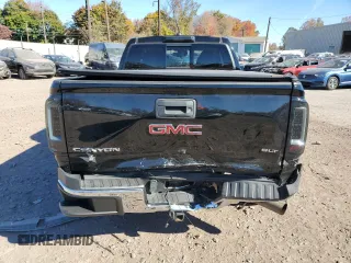 2016 GMC Canyon 4WD SLT with VIN 1GTP6DE11G1357147, listed as a Copart auction lot 77835344 with 106,890 mi miles and Salvage Title. Bid and sale history available at carsss.com. Image 6.