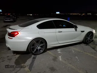2017 BMW M6 z VIN WBS6J9C56HD934812, wystawiony jako Copart lot #44018915 z przebiegiem 84 409 mil mil oraz Szkoda całkowita • Salvage title. Historia ofert i sprzedaży dostępna na DreamBid. Obrazek 3.