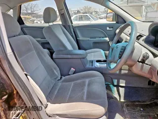 2005 Ford Five Hundred SE z VIN 1FAFP23135G155457, wystawiony jako Copart lot #59118245 z przebiegiem 157 582 mil mil oraz Tytuł czysty. Historia ofert i sprzedaży dostępna na DreamBid. Obrazek 5.