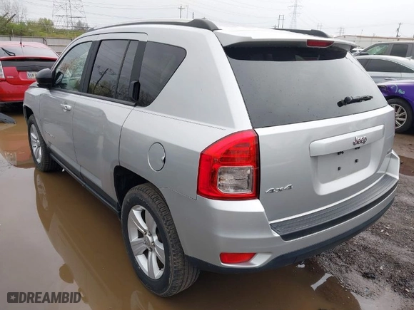 2011 Jeep Compass with VIN 1J4NF1FB6BD283741, listed as a IAAI auction lot 41948515 with 105,415 mi miles. Bid and sale history available at carsss.com. Image 3.