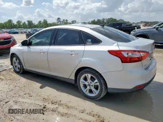 2013 Ford Focus SE with VIN 1FADP3F22DL263124, listed as a Copart auction lot 61583795 with 133,522 mi miles and Salvage title. Bid and sale history available at DreamBid. Image 2.