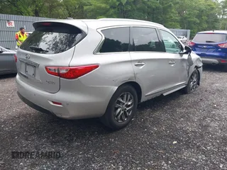 2014 Infiniti QX60 with VIN 5N1AL0MMXEC500998, listed as a IAAI auction lot 42596904 with 105,153 mi miles and . Bid and sale history available at DreamBid. Image 4.