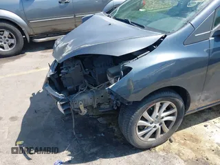 2012 Mazda 5 Sport with VIN JM1CW2BL1C0116150, listed as a IAAI auction lot 42571812 with 124,236 mi miles and . Bid and sale history available at DreamBid. Image 6.