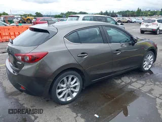 2014 Mazda 3 S Grand Touring with VIN JM1BM1M3XE1164610, listed as a IAAI auction lot 42421946 with 96,591 mi miles and . Bid and sale history available at DreamBid. Image 4.