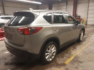 2014 Mazda CX-5 Grand Touring with VIN JM3KE4DY5E0305882, listed as a IAAI auction lot 41879532 with 173,443 mi miles. Bid and sale history available at carsss.com. Image 4.