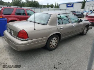2005 Ford Crown Victoria LX with VIN 2FAFP74W95X126417, listed as a Copart auction lot 73537004 with 246,163 mi miles and Salvage Title. Bid and sale history available at carsss.com. Image 3.