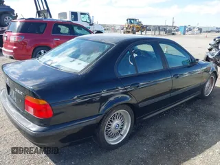 2000 BMW 5 Series 528iA with VIN WBADM6344YGU10257, listed as a IAAI auction lot 41773733 with 231,028 mi miles. Bid and sale history available at carsss.com. Image 4.