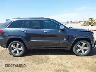 2015 Jeep Grand Cherokee Overland with VIN 1C4RJECG3FC635327, listed as a IAAI auction lot 41910559 with 118,519 mi miles and . Bid and sale history available at DreamBid. Image 13.