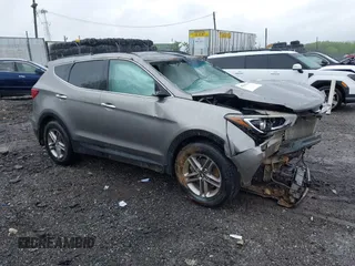 2017 Hyundai Santa Fe 2.4L z VIN 5NMZUDLB0HH009017, wystawiony jako IAAI lot #42301651 z przebiegiem Nie podano mil oraz . Historia ofert i sprzedaży dostępna na DreamBid. Obrazek 1.