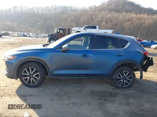 2018 Mazda CX-5 Touring z VIN JM3KFBCM2J0461954, wystawiony jako IAAI lot #41655865 z przebiegiem 129 333 mil mil oraz . Historia ofert i sprzedaży dostępna na DreamBid. Obrazek 13.