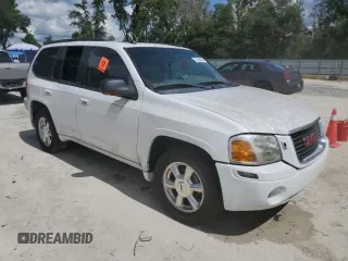 2005 GMC Envoy SLT with VIN 1GKDT13S052311455, listed as a Copart auction lot 73635434 with Not Provided miles and Salvage Title. Bid and sale history available at DreamBid. Image 4.