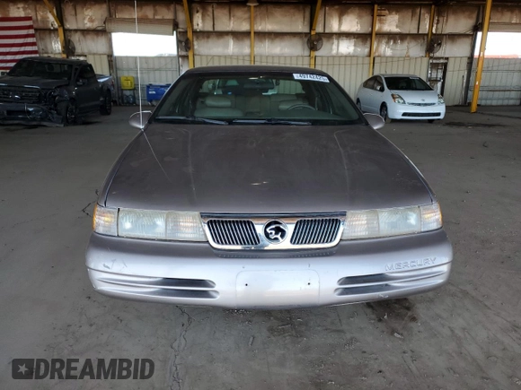 1995 Mercury Cougar z VIN 1MELM62W2SH613956, wystawiony jako Copart lot #49742425 z przebiegiem 94 806 mil mil oraz Tytuł czysty. Historia ofert i sprzedaży dostępna na DreamBid. Obrazek 5.