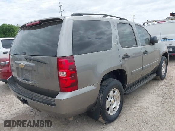 2007 Chevrolet Tahoe LS with VIN 1GNFC13C57R401893, listed as a IAAI auction lot 42046960 with 258,231 mi miles and . Bid and sale history available at DreamBid. Image 4.