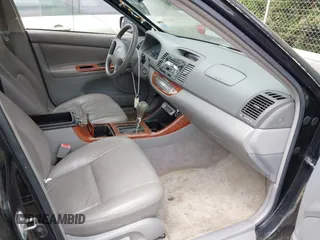 2003 Toyota Camry LE with VIN JTDBF32K430146557, listed as a IAAI auction lot 42102454 with 179,653 mi miles. Bid and sale history available at carsss.com. Image 5.