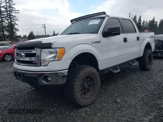 2014 Ford F-150 XL with VIN 1FTFW1EF1EKF65204, listed as a IAAI auction lot 41669195 with 84,882 mi miles. Bid and sale history available at carsss.com. Image 2.