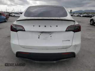2023 Tesla Model Y Performance z VIN 7SAYGDEFXPF801908, wystawiony jako Copart lot #50737655 z przebiegiem Nie podano mil oraz Szkoda całkowita • Salvage title. Historia ofert i sprzedaży dostępna na DreamBid. Obrazek 6.