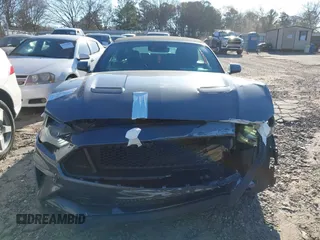 2021 Ford Mustang EcoBoost z VIN 1FATP8UH3M5105279, wystawiony jako IAAI lot #41712821 z przebiegiem 99 760 mil mil oraz . Historia ofert i sprzedaży dostępna na DreamBid. Obrazek 12.