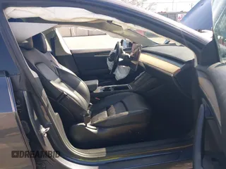2022 Tesla Model 3 with VIN 5YJ3E1EA1NF142713, listed as a IAAI auction lot 42027630 with 112,557 mi miles. Bid and sale history available at carsss.com. Image 5.