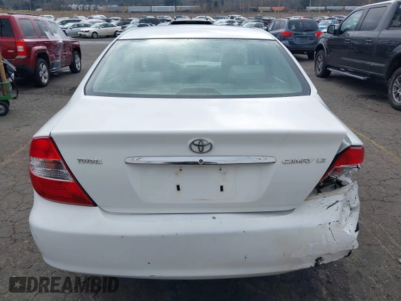 2002 Toyota Camry LE z VIN 4T1BE32K52U081479, wystawiony jako IAAI lot #41344104 z przebiegiem 243 950 mil mil oraz . Historia ofert i sprzedaży dostępna na DreamBid. Obrazek 16.