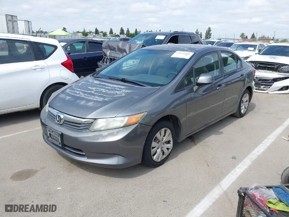 2012 Honda Civic Sdn LX with VIN 19XFB2F58CE370319, listed as a IAAI auction lot 42036096 with 153,562 mi miles. Bid and sale history available at carsss.com. Image 2.