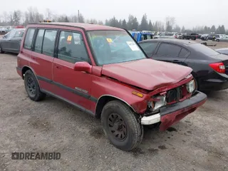1995 Suzuki Sidekick z VIN JS3TD03V3S4106626, wystawiony jako IAAI lot #41877506 z przebiegiem 166 928 mil mil oraz . Historia ofert i sprzedaży dostępna na DreamBid. Obrazek 1.