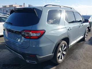 2024 Honda Pilot Touring with VIN 5FNYG1H74RB020112, listed as a IAAI auction lot 41698998 with 11,612 mi miles. Bid and sale history available at carsss.com. Image 4.