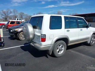 2002 Isuzu Trooper S with VIN JACDJ58X327JOO132, listed as a IAAI auction lot 41830954 with 192,828 mi miles and . Bid and sale history available at DreamBid. Image 4.
