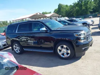2015 Chevrolet Tahoe LTZ z VIN 1GNSKCKC3FR104845, wystawiony jako IAAI lot #42291785 z przebiegiem 75 047 mil mil oraz . Historia ofert i sprzedaży dostępna na DreamBid. Obrazek 13.