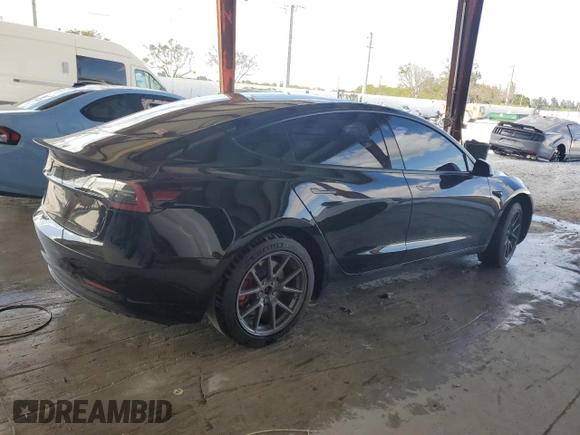2021 Tesla Model 3 Standard Range Plus with VIN 5YJ3E1EA2MF048564, listed as a Copart auction lot 88754285 with 57,894 mi miles and Non Repairable. Bid and sale history available at DreamBid. Image 3.