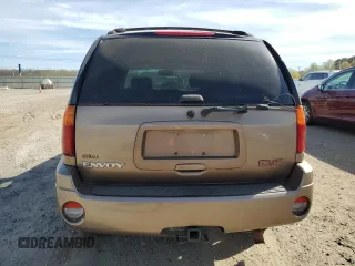 2003 GMC Envoy SLT z VIN 1GKDS13S032134647, wystawiony jako Copart lot #50137325 z przebiegiem 217 878 mil mil oraz Szkody całkowita. Historia ofert i sprzedaży dostępna na DreamBid. Obrazek 6.