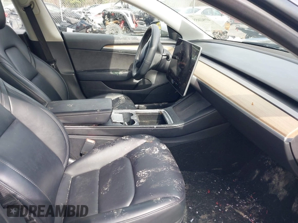 2023 Tesla Model 3 z VIN 5YJ3E1EA5PF451085, wystawiony jako IAAI lot #41941655 z przebiegiem 56 532 mil mil oraz . Historia ofert i sprzedaży dostępna na DreamBid. Obrazek 5.