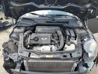 2015 MINI Coupe S z VIN WMWSX3C55FT409449, wystawiony jako Copart lot #66574174 z przebiegiem 99 155 mil mil oraz Szkody całkowita. Historia ofert i sprzedaży dostępna na DreamBid. Obrazek 11.