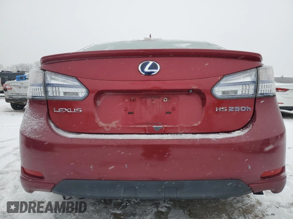 2010 Lexus HS 250h with VIN JTHBB1BA9A2005121, listed as a Copart auction lot 87825175 with 124,594 mi miles and Salvage Title. Bid and sale history available at DreamBid. Image 6.