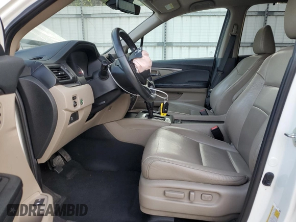 2019 Honda Pilot EX-L with VIN 5FNYF5H44KB009679, listed as a Copart auction lot 62210505 with 148,628 mi miles and Salvage title. Bid and sale history available at DreamBid. Image 7.
