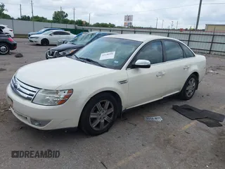 2009 Ford Taurus Limited z VIN 1FAHP25W79G104342, wystawiony jako IAAI lot #42140990 z przebiegiem 130 214 mil mil oraz . Historia ofert i sprzedaży dostępna na DreamBid. Obrazek 2.