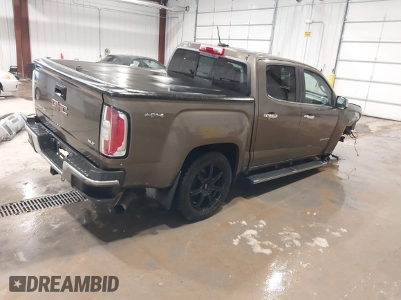 2016 GMC Canyon 4WD SLT z VIN 1GTP6DE13G1229783, wystawiony jako IAAI lot #41583360 z przebiegiem 80 149 mil mil oraz . Historia ofert i sprzedaży dostępna na DreamBid. Obrazek 4.