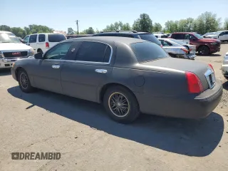 2001 Lincoln Town Car Cartier L z VIN 1LNHM85W71Y624315, wystawiony jako Copart lot #60479385 z przebiegiem 171 485 mil mil oraz Czysty tytuł • Clean title. Historia ofert i sprzedaży dostępna na DreamBid. Obrazek 2.