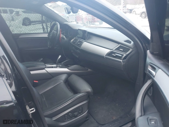 2011 BMW X6 M with VIN 5YMGZ0C57BLK14388, listed as a IAAI auction lot 41411854 with 129,248 mi miles. Bid and sale history available at carsss.com. Image 5.