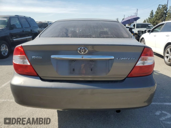 2004 Toyota Camry LE z VIN 4T1BE32K34U881717, wystawiony jako Copart lot #53731565 z przebiegiem Nie podano mil oraz Szkoda całkowita • Salvage title. Historia ofert i sprzedaży dostępna na DreamBid. Obrazek 6.