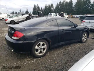 2006 Hyundai Tiburon GS with VIN KMHHM65DX6U225464, listed as a Copart auction lot 83561984 with 182,245 mi miles and Salvage Title. Bid and sale history available at carsss.com. Image 3.