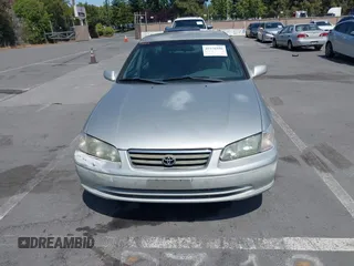 2001 Toyota Camry CE z VIN 4T1BG22K01U101673, wystawiony jako IAAI lot #42576596 z przebiegiem 200 064 mil mil oraz . Historia ofert i sprzedaży dostępna na DreamBid. Obrazek 6.
