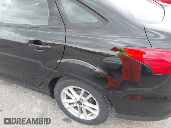 2016 Ford Focus SE with VIN 1FADP3F29GL245580, listed as a IAAI auction lot 41924810 with 111,090 mi miles and . Bid and sale history available at DreamBid. Image 6.