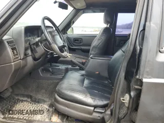 1999 Jeep Cherokee Sport with VIN 1J4FF68S9XL635836, listed as a Copart auction lot 59573195 with 187,035 mi miles and Salvage title. Bid and sale history available at DreamBid. Image 7.