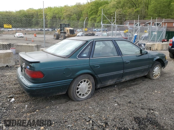 1995 Ford Taurus GL with VIN 1FALP52U8SA179395, listed as a Copart auction lot 53614265 with 71,082 mi miles and Salvage title. Bid and sale history available at DreamBid. Image 3.