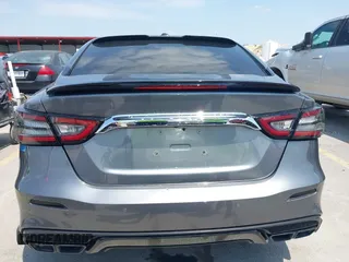 2020 Nissan Maxima SR with VIN 1N4AA6EVXLC383592, listed as a IAAI auction lot 42058071 with 103,014 mi miles and . Bid and sale history available at DreamBid. Image 16.