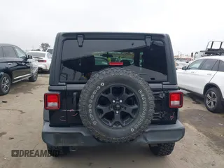 2021 Jeep Wrangler Sport with VIN 1C4GJXAN5MW627228, listed as a IAAI auction lot 42170010 with 56,965 mi miles and . Bid and sale history available at DreamBid. Image 16.