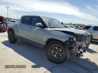 2022 Rivian R1T Adventure z VIN 7FCTGAAAXNN014983, wystawiony jako Copart lot #48987605 z przebiegiem Nie podano mil oraz Szkoda całkowita • Salvage title. Historia ofert i sprzedaży dostępna na DreamBid. Obrazek 4.